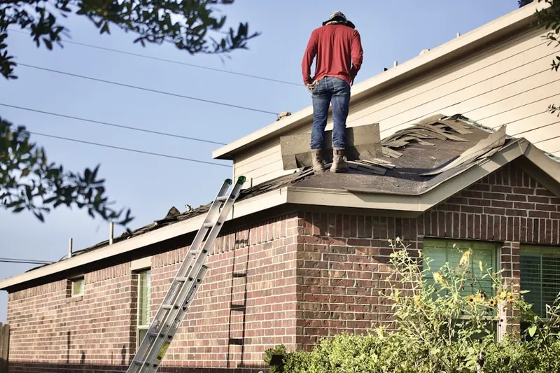 Professional roofer working on a residential roof in California